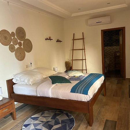 كوتونو L'Oasis Guesthouse المظهر الخارجي الصورة